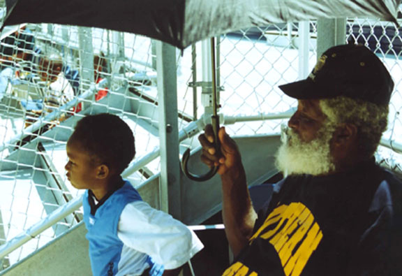 BEN LOVE THE KIDS Benjamin Keller, Sr (AKA Po' Ben) doesn't miss a Jaguar home baseball come rain or shine and sometimes come rain &amp; shine to beat the heat. - - Photo by Nikki G. Bannister/DIGEST