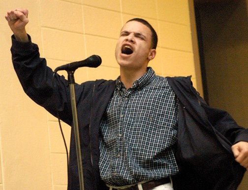 Poet James "P.I.M.P." Walker performs his poem "Unity" at the celebration. - PHOTO BY RYAN P. KNIGHT // SOUTHERN DIGEST