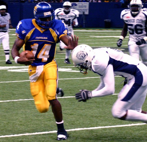 Southern University quarterback Thomas Ricks stiff arms a Jackson State defender in the Jaguars 45-7 win over the Tigers at the Big Easy Classic in the New Orleans Superdome. Ricks finished the game 32 of 45 for 353 yards and three touchdowns. Ricks also