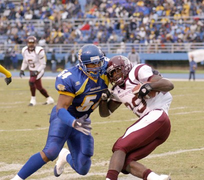 Senior linebacker Tarus Morgan stuffs TSU running back Ramond Gilmore's run for a loss of one yard. Morgan finished the game with seven tackles and a 27-yard touchdown interception.