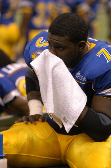 Jags' junior center Brandon Jones sits on the sidelines during the last minutes of the game.