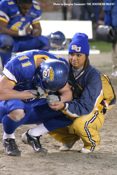 CONSOLATION Southern University senior punter Colby Miller is consoled by a Jaguar faithful after the team was defeated by Alabama State 40-35 in the Southwestern Athletic Conference Championship game in Birmingham, Ala. The game was held in historic Leg