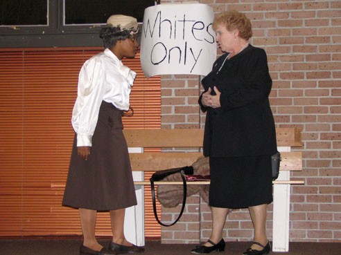 In the skit "Florence" the Lacumba Players' characters Mama played by Nancy Lynch (left) and Mrs. Carter played by Dr. Aileen Hendricks (right) reenact a scene about Blacks being seperated from Whites during the Civil Rights Movement. PHOTO BY BRITTANY T