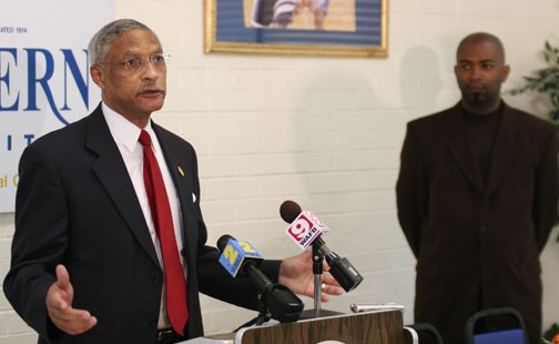 Southern University Chancellor Dr. Edward Jackson address the media while sports information director Kevin Manns looks on during Thursday's press conference announcing the termination of men's basketball head coach Michael Grant. PHOTO BY JOSH HALLEY