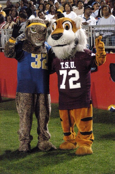 Mascots from Southern University and Texas Southern University share a moment during a 2003 football game. DIGEST FILE PHOTO