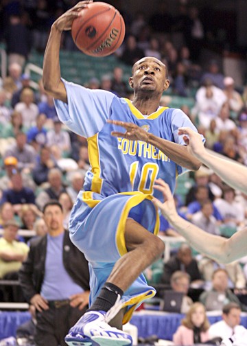 Jaguars' senior guard Chris Alexander scores two of his 19 points off of a fast-break layup Thursday night as the Jaguars drop the NCAA opening round game against #1 seeded Duke University at the Greensboro ColIsieum. PHOTO BY JOSHUA L. HALLEY