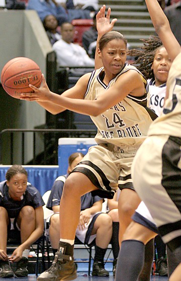 Arkansas-Pine Bluff junior forward Latorya Thomas looks to pass before returning to the ground in order to avoid a traveling penalty. (PHOTO BY JOSHUA L. HALLEY)