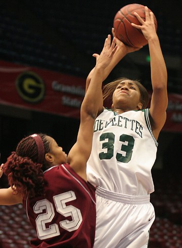 Mississippi Valley State junior forward Ashley Robinson barely gets a shot off as Alabama A&amp;M freshmen guard Christian Malone closes in on defense. (JOSHUA L. HALLEY)