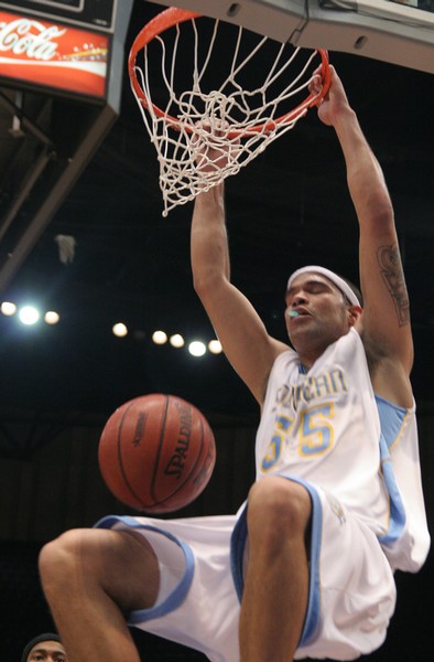 Jaguars' sophomore forward Ralph Hisawh slams the ball through the rim to score two of his four total points. (JOSHUA L. HALLEY)