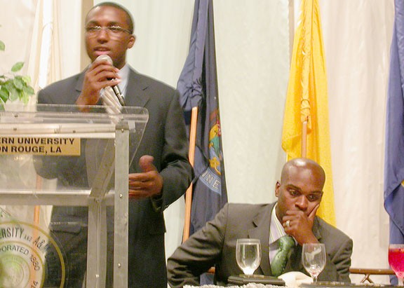 The 2005-06 SGA President Justin McCorkle sits back as newly-elected President Niiobli Armah IV gives his closing remarks during the SGA Installation Banquet Tuesday night. PHOTO BY CLARISSA GRANGER