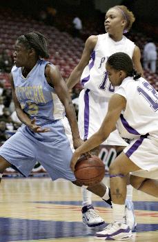 Lady Panthers guard Tanesha Barefield strips the ball from Jaguars guard Aerica Hicks late in the second half during the Lady Panthers' 80-49 SWAC Basketball tournament quarterfinal victory over the defending SWAC Tournament Champion Jaguars. The Lady Panthers outhustled the Jaguars on both end of the court by grabbing 38 rebounds and 12 steals. The Lady Panthers also took care of the ball by only committing 12 turnovers while the Jaguars committed 22.