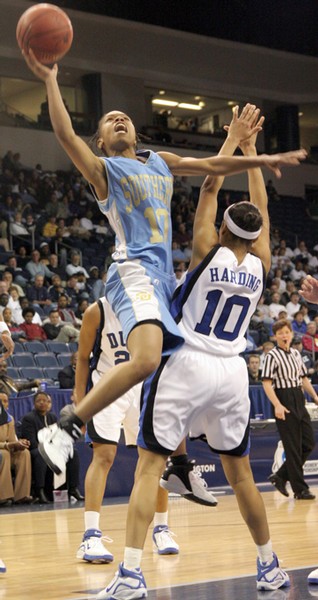 Southern University senior guard Ciara Shiggs rises over Duke guard Lindsey Harding for a layup in the Jaguars first round loss at the 2006 NCAA Division I Women's Basketball Tournement, in Norfolk Va. - Photo by Douglas W. Toussaint, Jr. // The Southern