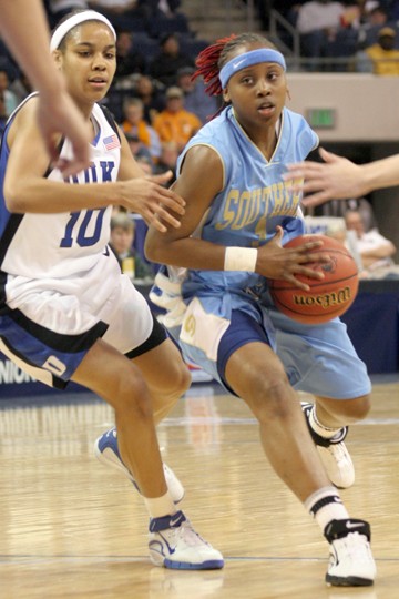 Jags point guard Tiffany Jones drives past Duke guard Lindsey Harding for a layup in the Jaguars first round loss at the 2006 NCAA Division I Women's Basketball Tournement, in Norfolk Va. - Photo by Douglas W. Toussaint, Jr. // The Southern DIGEST