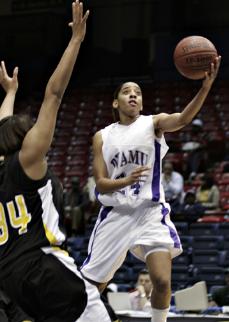 Prairie View A&amp;M Freshmen Candice Thomas finishes a fast break with a layup to score two points during Friday afternoons semi-final game versus the Grambling State Lady Tigers. Thomas' 22 points and three steals and assists helped the Lady Panthers cruise to a 77-55 victory over the Lady Tigers and they will play in the SWAC Womens' Basketball Championship Game at 3PM on Saturday in Birmingham's BJCC Arena.