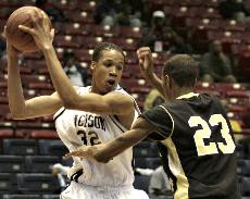 JSU's forward Grant Maxey looks to drive pass UAPB's forward William Byrd in the 2007 SWAC Basketball Tournament Semifinal on Friday. Maxey finished with a register of 11 points and six rebounds as he helped lead the Tigers to a 64-62 victory over UAPB. Byrd registered eight points and eight rebounds for UAPB.