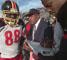 Grambling State football coach Eddie Robinson talks with players Tyree Madison (88) and Chiron Applewhite, right, at the Cramton Bowl in Montgomery, Ala., in this Nov. 9, 1997 file photo.