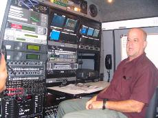 Robert Riddick, a news photographer and up linker, explains the purpose of a Digital Satellite News Vehicle to interested students on August 17, 2007 at Stewart Hall.