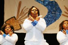 Members of Alpha Tau Chapter of Delta Sigma Theta get set to perform their routine at Friday night's annual Homecoming Greek Show. the Delta's tied the with the Zetas for first place in the greek show.