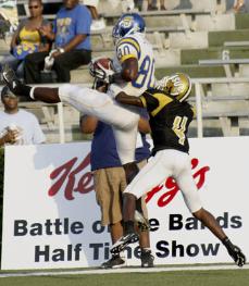 Southern University wide receiver Gerard Landry hauls in a 23-yard touchdown over Alabama State cornerback Jimmy Toussaint in Southern's 21-2 win on Saturday at Ladd-Peebles Stadium.