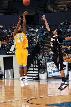 Southern University forward Douglas Scott shoots a three over Grambling State&#8217;s Jordan Lemons during Saturday&#8217;s 68-57 win over the G-Men. The Jaguars fell to Jackson State 67-55 Monday night.