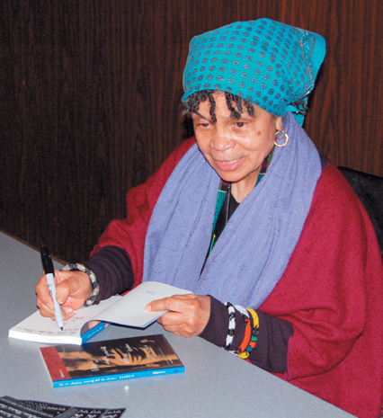 Award-winning poet Sonia Sanchez signs autographs for those in attendance to hear her speak Wednesday night. She has authored over a dozen books as well as published several plays.