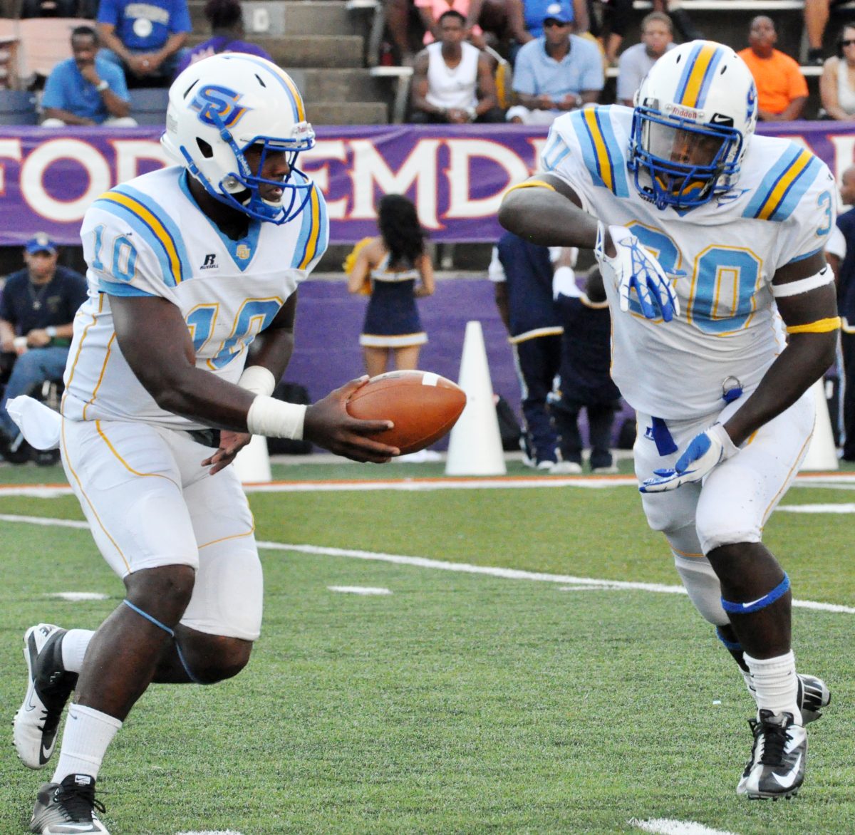 Southern quarterback Dray Joseph passes the the ball to running back Darrius Coleman during the match-up against Northwestern State in Natchitoches Saturday. The Jaguars lost the game 55-14.