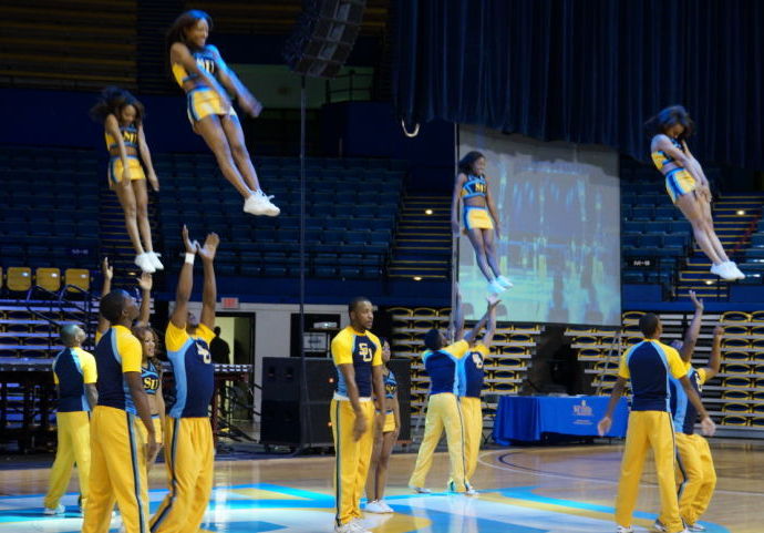 Cheer leaders perform their routines Sunday to kickoff homecoming week at the F.G. Clark Activity Center &#160;