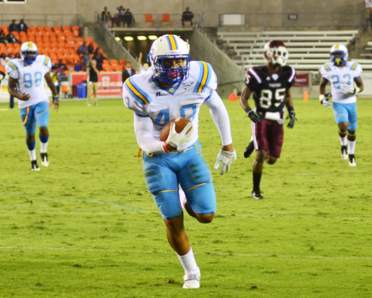 Southern linebacker Anthony Balancier runs the ball to the goal line for a touchdown after an interception during the game Friday in Houston, Tx against Texas Southern University.