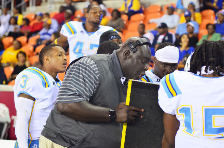 Coach Dawson Odums goes over plays during a timeout in the matchup between the Southern Jaguars and Texas Southern Tigers Friday night in Houston, Texas