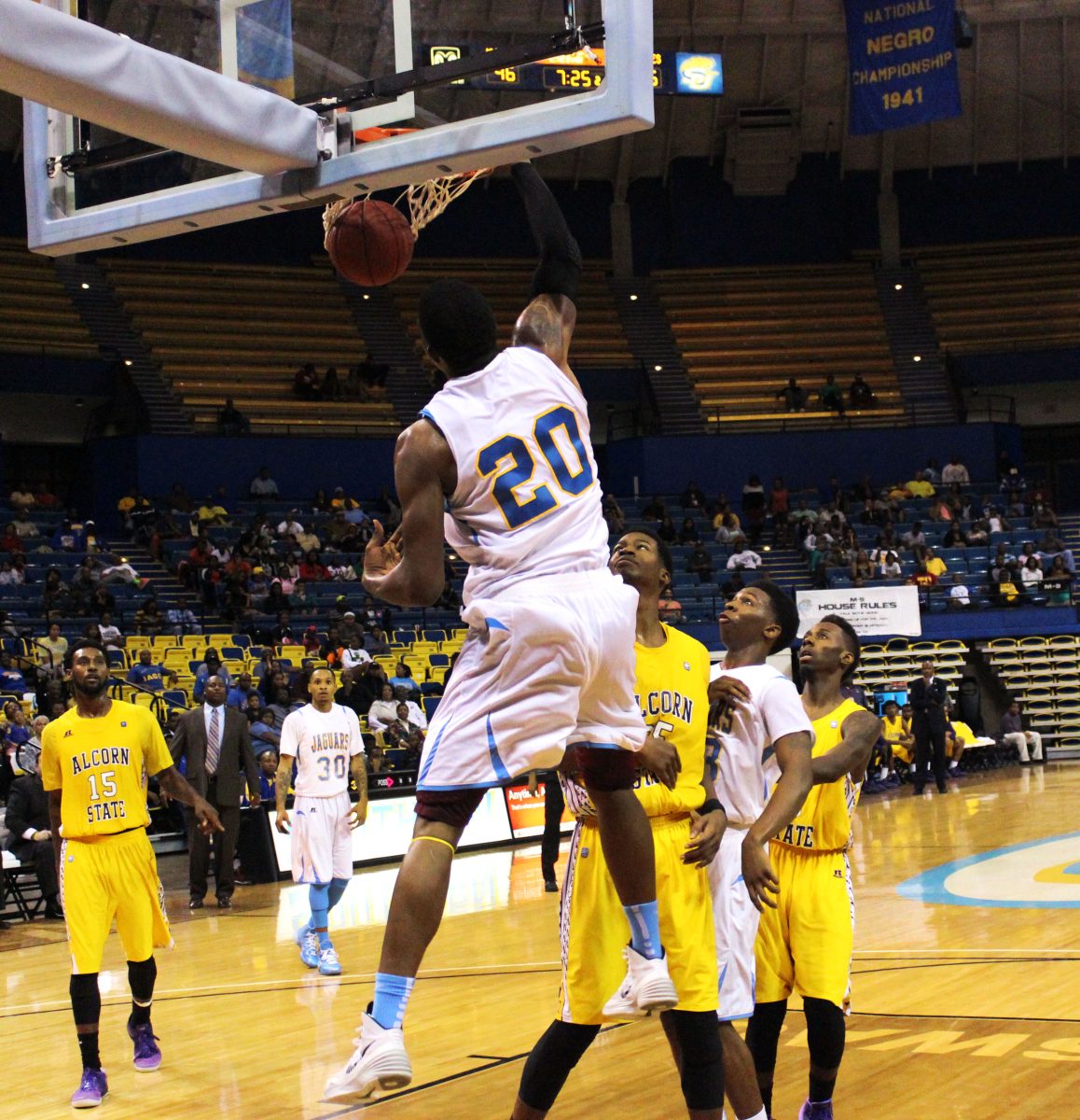 Number 20, Calvin Godfrey, throws down a dunk in the Southern vs. Alcorn State men's basketball game in the F. G. Clark Activity center.