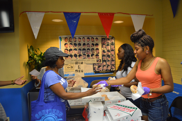 Volunteers spend their time in the Union Barbershop on the first day of school, August 18th, to hand out doughnuts and orange juice to accomodate students on the first day of school.
&#160;