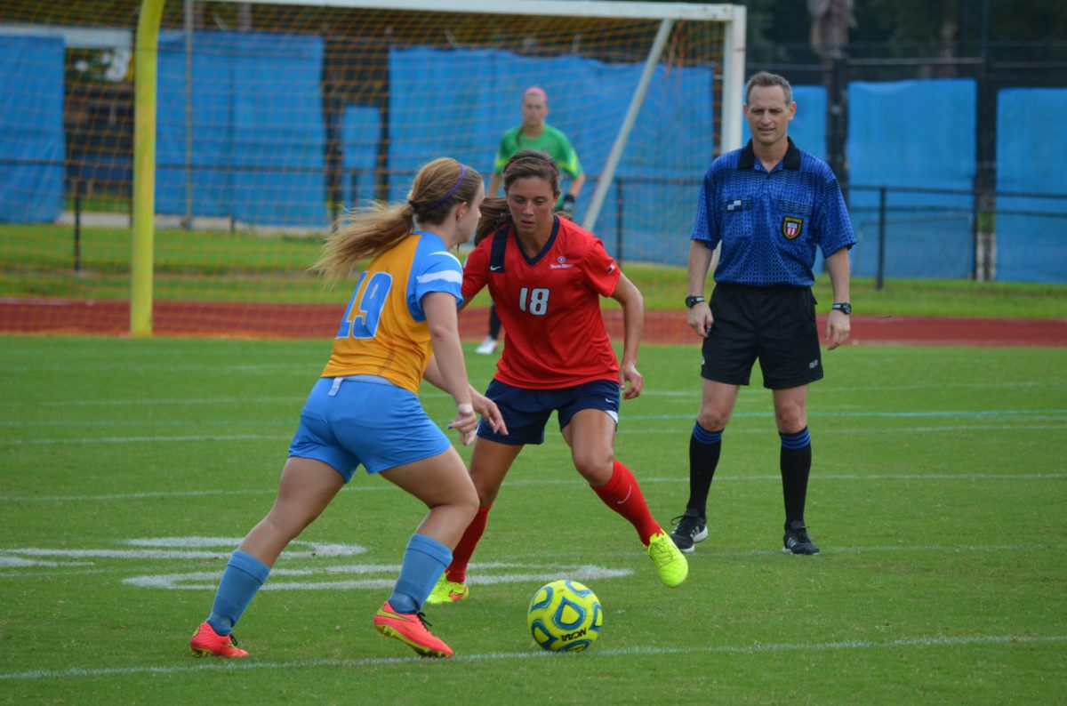 Freshman mid-fielder Jessica Persico maneuvers against a South Alabama defender during the competition held September 5, 2014 in A.W Mumford Stadium.
&#160;