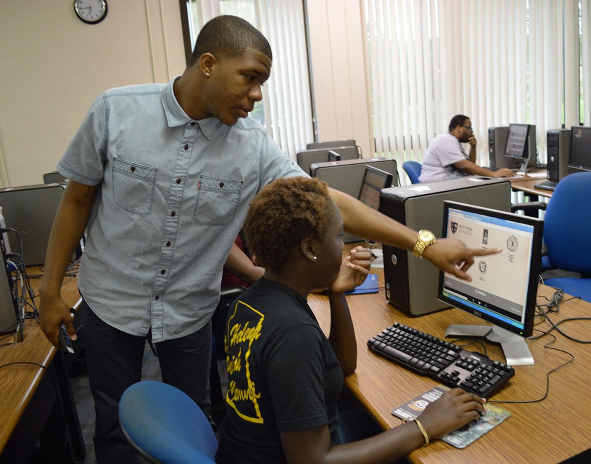 19 year old sophomore Tevente Bennett helps fellow sophomore Jada Robinson vote during the voting party for Allstate&#8217;s HBC-I-Owe-U contest in the Smith Brown Memorial Student Union&#8217;s computer lab.
&#160;
&#160;