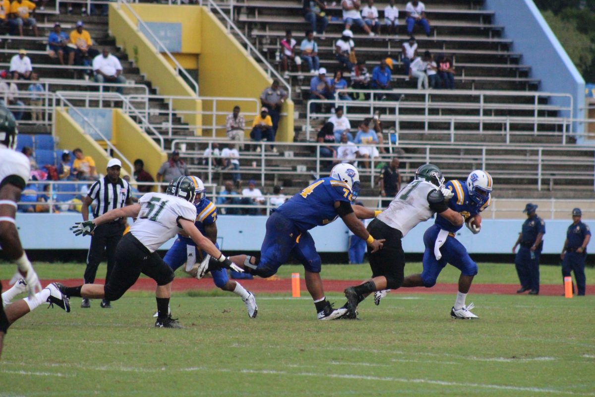 Junior running back Malcolm Crockett tussles with a Central Methodist defender as he eyes the endzone. The Jaguars prevailed 56-14 Saturday, September 6, 2014 in A.W. Mumford Stadium.&#160;