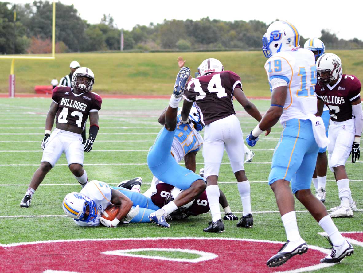 Malcolm Crockett dives in for the winning touchdown against Alabama A&amp;M during the closing seconds of the fourth quarter, which propelled the Jaguars their second consecutive conference victory.