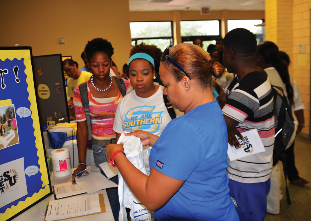 A representaive from the Southern University Health Center encourages students to sign up for the Jags Get Fit initiative, and informs the students on ways to stay healthy while living on campus.