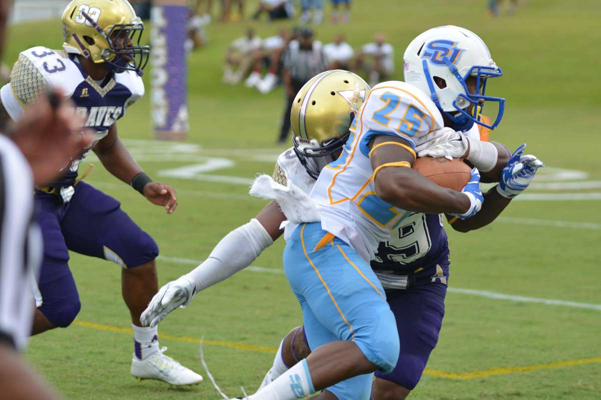 Freshman linebacker Lemar Martin and freshman linebacker Jordan Taylor hold down Alcorn's offense during the SU vs. Alcorn State game Saturday, September 27, 2014.