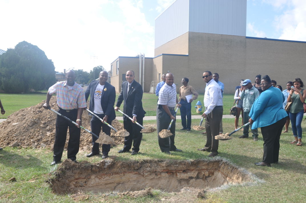 Cordell Veal, Director of Landscaping Services, SGA President Nicholas Harris, Acting Chancellor Flandus McClinton, Vice Chancellor for Student Affairs &amp; Enrollment Management, Dr. Brandon K. Dumas, Marcus Coleman, Dean of Students, and Interim SU Police Chief Joycelyn Johnson pour dirt into the Centennial time capsule.