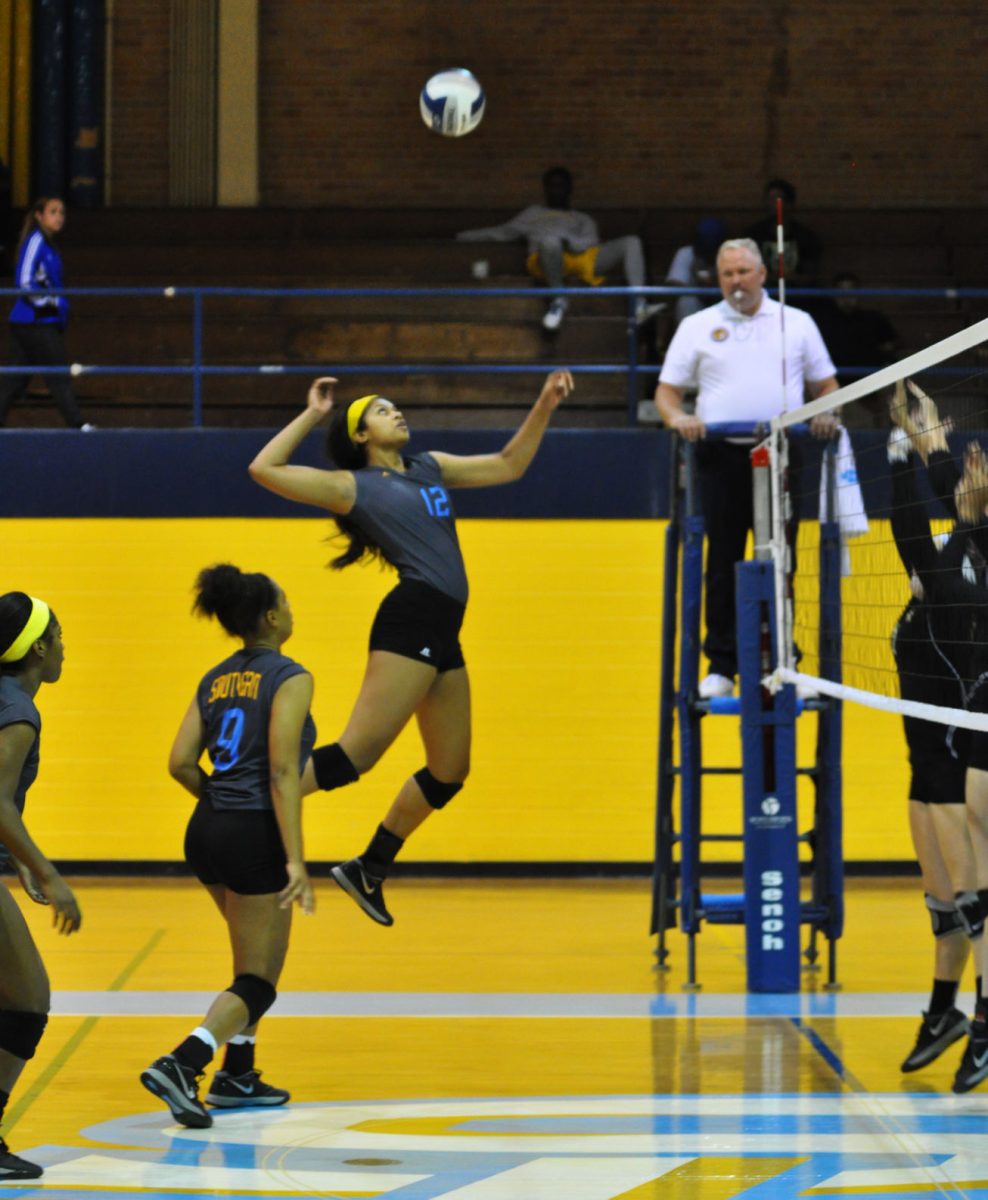 Middle blocker Lailani Lealaimatafao jumps for the kill in the volleyball game between SU and UAPB in Seymour gym.