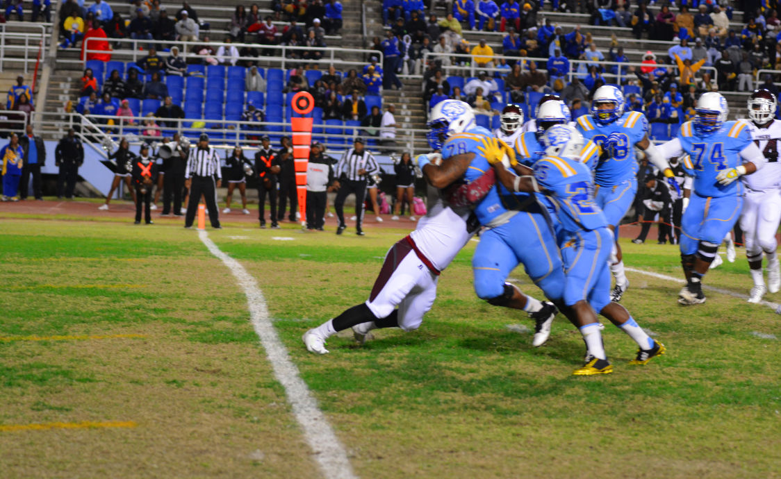 Redshirt Junior offensive lineman Reginald Redding steams forward over a Texas Southern defender as he clears the endzone after recovering a fumble.
&#160;