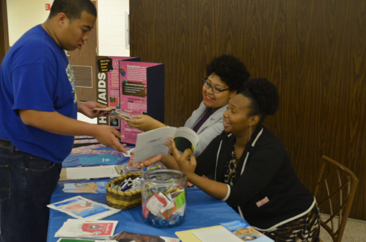 Freshman student recieves helpful information about HIV/AIDS Awareness.