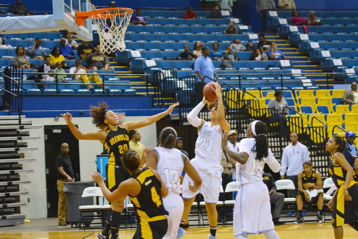 Britney Washington pulls up a quick jumper over a group of defenders. Washington scored a game high 21 points against Grambling State on Saturday, Febuary 7 in F.G. Clark Activity Center.