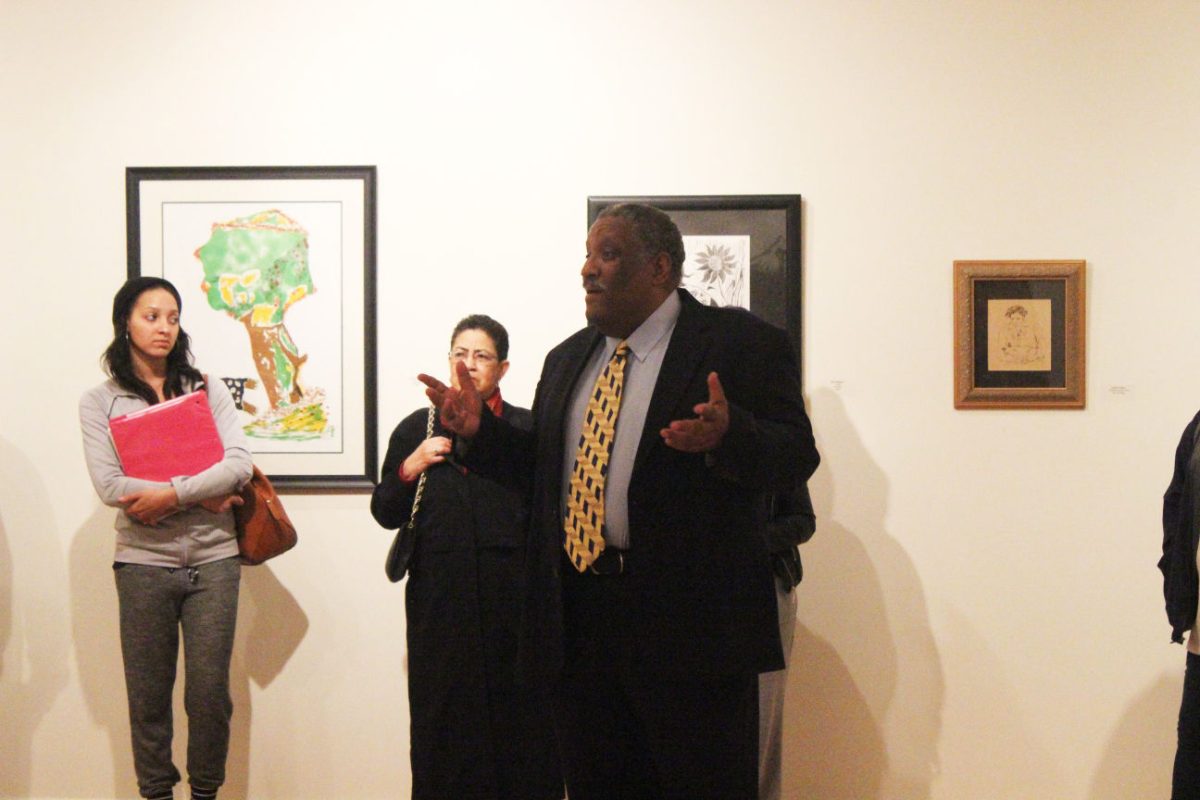 Irving Jones, a Baton Rouge native African American art collector speaks to students about where to begin and the benefits of collecting art during the opening reception of the Irvin Jones art exhibiton in Frank Hayden Hall on Wednesday, February 4.