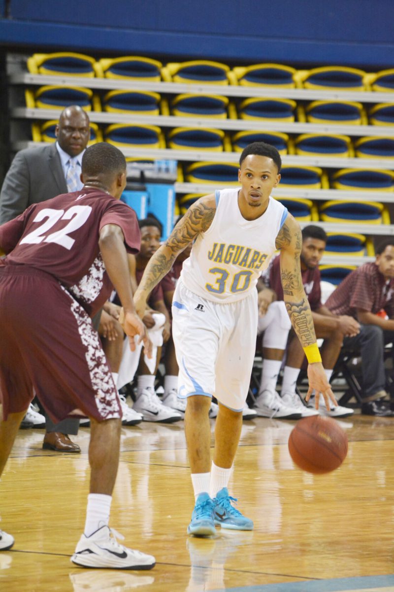 Southern University Basket Ball team Guard, Tre Lynch, going for the basket while being guarded by Alabama A&amp;M Basketball team guard, Tyler Davis.