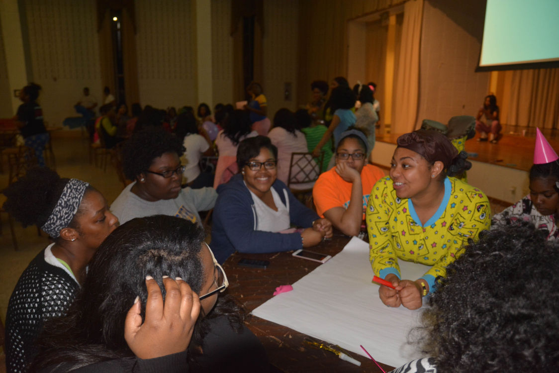 SU students brainstorming at the ThinkSmartBeSAFE "Girls Night In" in the cotillion ballroom on March 16, hosted by Association of Women Students in collaboration with Collegiate 100 Black Women, Be S.A.F.E, and the Divine Nine sororities.