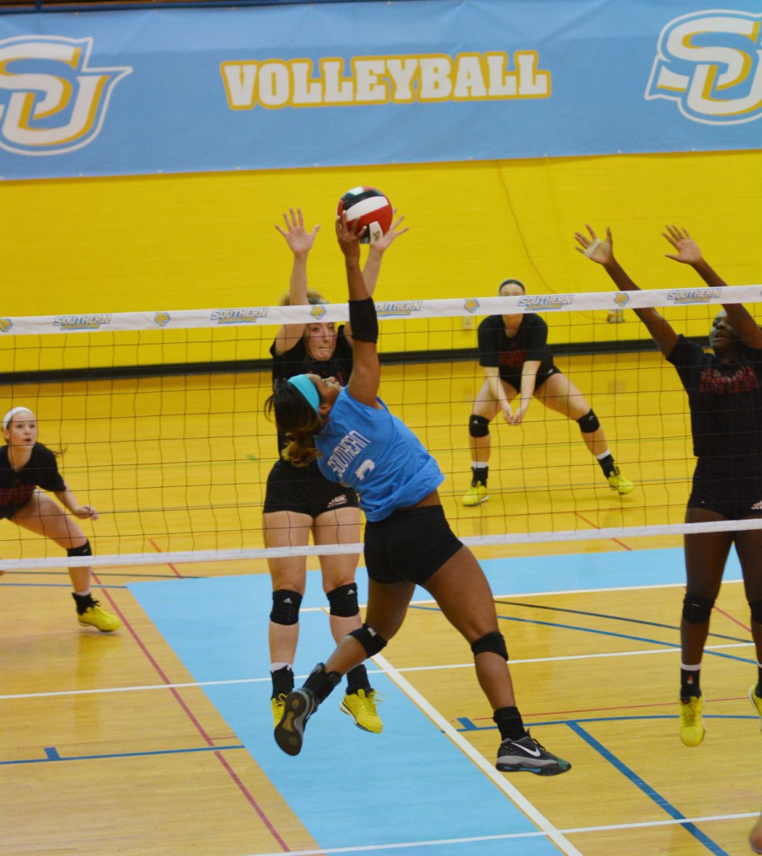 Southern University Sophomore Outside Hitter Melodie Malone takes flight for the strong spike during Saturdays game against the University of Louisiana Lafayette.