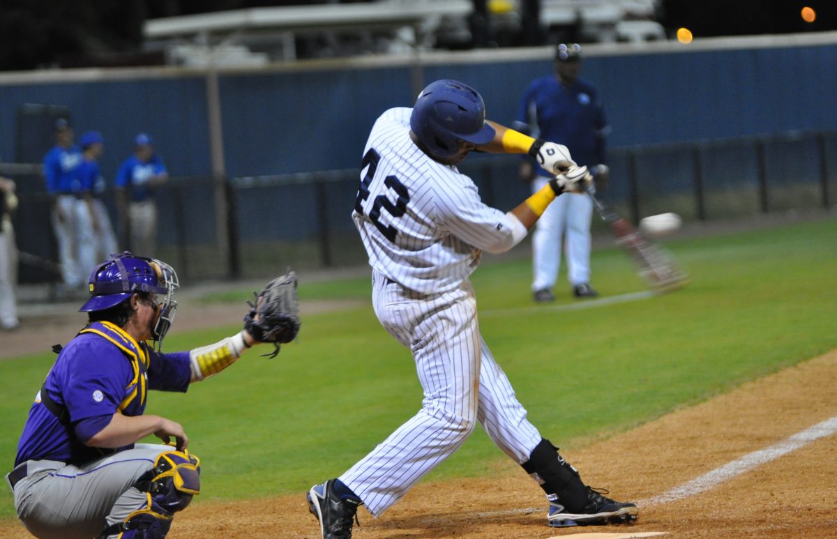 Senior Outfielder Stephen Wallace drives the ball past second base during tuesdays game against Louisiana State University.