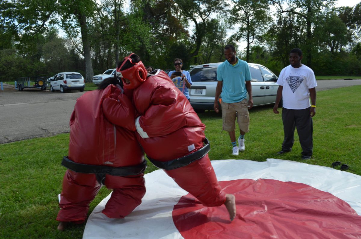 Students have fun in the suma suits for the Reslife Carnival.