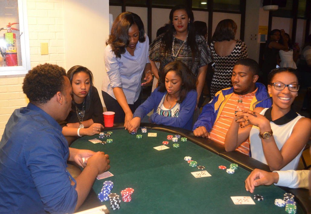 Southern University students participate in a game of Pokeduring Harlem Nights Casino and Lounge hosted by Alpha Kappa Alpha Sorority Inc in the Student Union Gameroom.