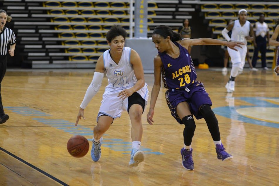 Southern University guard Britney Washington dribbles down the court evading a Alcorn State defender in F.G. Clark Activity Center on Saturday, February 28.
&#160;